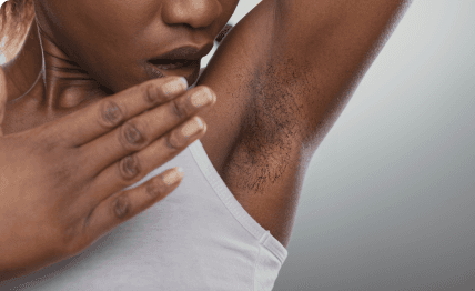 Woman feeling self-conscious about unwanted underarm hair.